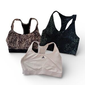 Multiples Sports Bras in Animal Print, Speckled Black, and Solid Cream